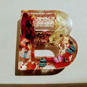 B Resin art featuring butterflies and flowers